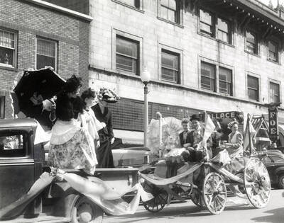 A group of people riding on a float in Our Lady of Lourdes Academy's senior class parade in Wallace, Idaho.