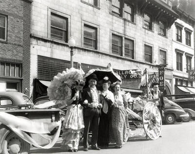 A group of people riding on a float in Our Lady of Lourdes Academy's senior class parade in Wallace, Idaho.
