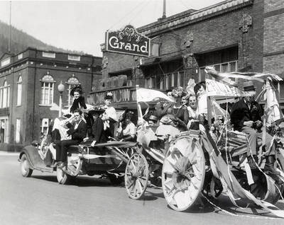 A group of people riding on a float in Our Lady of Lourdes Academy's senior class parade in Wallace, Idaho.