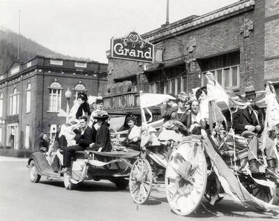 A group of people riding on a float in Our Lady of Lourdes Academy's senior class parade in Wallace, Idaho.