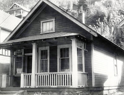 Exterior view of the house at 718 residence Street in Wallace, Idaho. Taken for J.A. Peterson Agency.