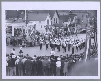 A float draped with American flags, foliage, and an elk's head driving along during the Elks Roundup Parade in Wallace, Idaho.