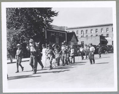 A woman in costume posing for the camera during the Children's Parade.