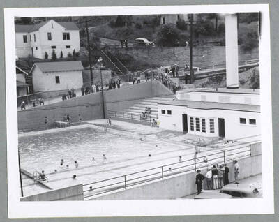 People swimming in the Wallace Swimming Pool. The pool is owned by the City of Wallace and was constructed in 1939 under a public works program of the federal government.