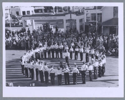 A person riding on the back of a decorated truck during the Elks Roundup Parade in Wallace, Idaho.