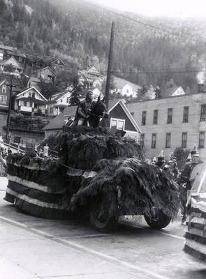 A man sitting on a horse on top of a float during the Elks Roundup parade in Wallace, Idaho.