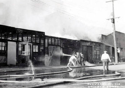 Firefighters putting out the garage fire on Residence Street in Wallace, Idaho.