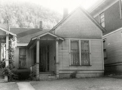 A photograph of a home in Wallace, Idaho, taken for J.A. Peterson Real Estate Company.