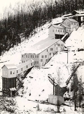 Exterior view of the Coeur d'Alene Mine mill during the winter, in Osburn, Idaho.