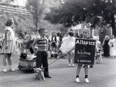 Children in costume with their pets during the Slippery Gulch parade in Wallace, Idaho.