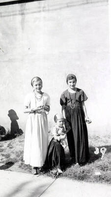 Three children in costume during the 49'er Parade in Mullan, Idaho.