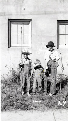 Three children in costume during the 49'er Parade in Mullan, Idaho.