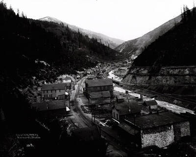 Image is of "The Canyon," near Hecla Mill, showing two lines of standard gauge railway on 4% grade, two railway spurs and two flumes.