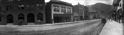 View of street in town. Panoramic photograph of Wallace, Idaho. Street Scene.