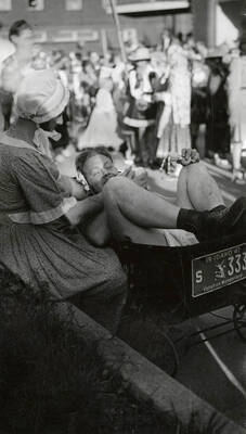 A man dressed as a baby in a wagon during the Mullan 49'er parade in Mullan, Idaho.
