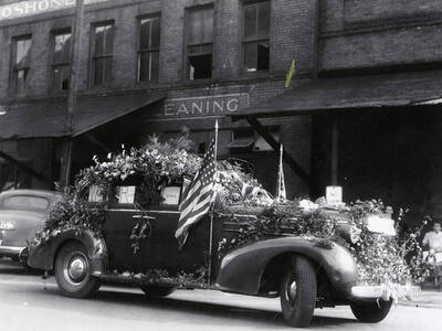 A car being driven in the Elks Roundup parade in Wallace, Idaho.