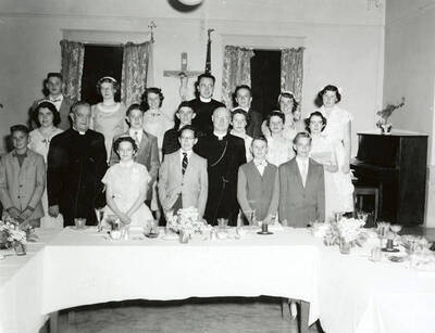 Group photo of the 8th grade graduates of Our Lady of Lourdes Academy in Wallace, Idaho.
