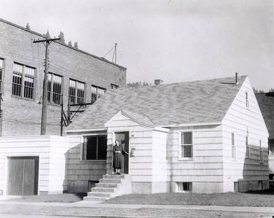 Rev. Martin A. Russert and his wife walking into the Bethany Lutheran Church and parsonage in Wallace, Idaho.