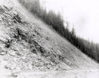 A photograph of an exposed roadside bank. Part of a Colonial Construction Company worksite.