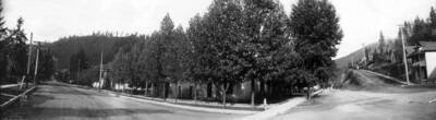 View of dirt roads and houses. Panoramic photograph of Wallace, Idaho.