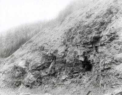 A photograph of an exposed roadside bank. Part of a Colonial Construction Company worksite.