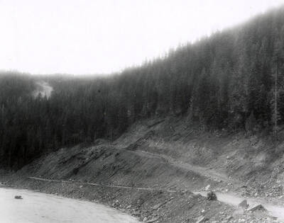 A photograph of an exposed roadside bank. Part of a Colonial Construction Company worksite.