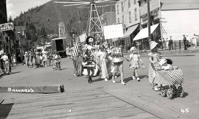 Children, who are in costume, walking in the Mullan 49'er parade in Mullan, Idaho.