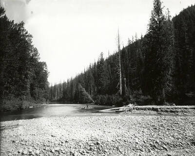 Canoes on the bank at the mouth of Prichard Creek, near North Fork by the Coeur d'Alene Mining District.