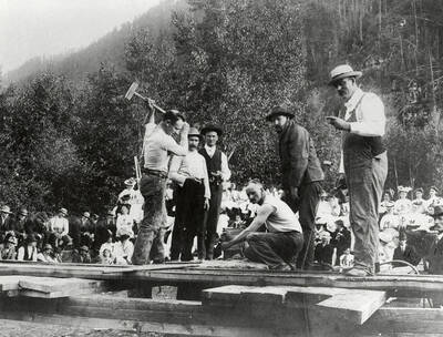 A group of men participating in a single jacking contest during Labor Day in Murray, Idaho. Walter Jay, driller; Walter Keister, Chas. Craven, time keeper; Jess Kesi,driller; pete Spaulding; Ed Collengen, time keeper.