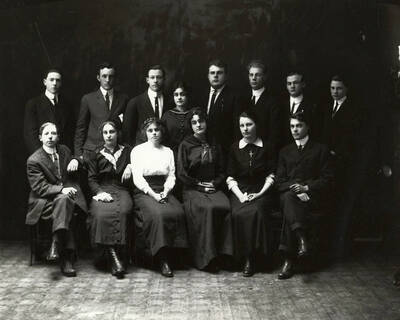 Group photo of the fourteen staff members of Wallace High School.