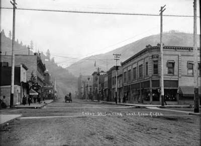 Image shows Cedar St. looking east from fifth in Wallace, Idaho.