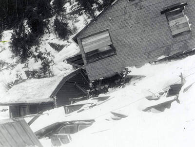 The snow slide that happened near Burke, Idaho on the Wallace side. A few houses can be seen covered in snow.