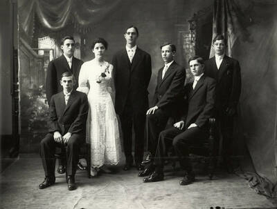 Group photo of the Wallace High School graduating class of 1910. Pictured are Jessie McKibben, L.C. Beamer, Bert Woolridge, Arthur Dunkle, Frank Hart, Lawrence Mason and George Thostenson.
