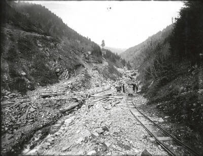 Men standing near the entrance to Hercules #4 after a flood.