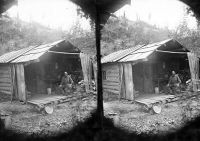 Image shows Archie Smith in front of his cabin on Eagle Creek, Idaho.