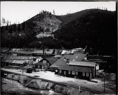 A very organized mill next to a river