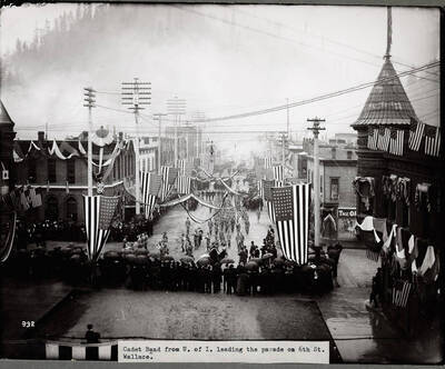 Caption on Front: Cadet Band from U. of I. leading the parade on 6th St. Wallace.