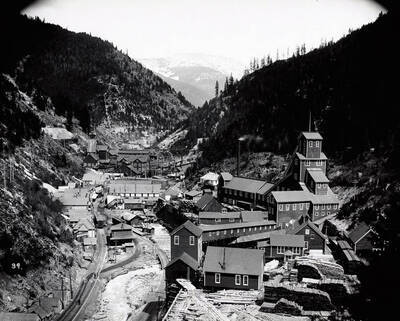 A distant view of Burke, Idaho [1910] showing Hecla yard and shaft house in foreground, Tiger - poor man plant in background.