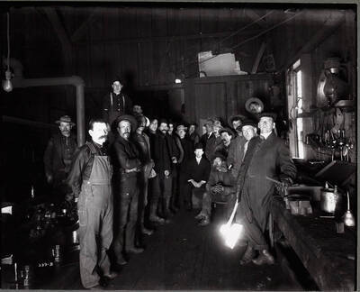 Interior; showing group of men