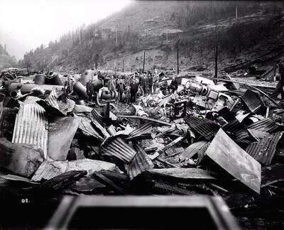 Image shows the debris from the Coeur d'Alene Hardware Warehouse on September 3, 1910 after the fire on August 20, 1910 swept went through Wallace, Idaho.
