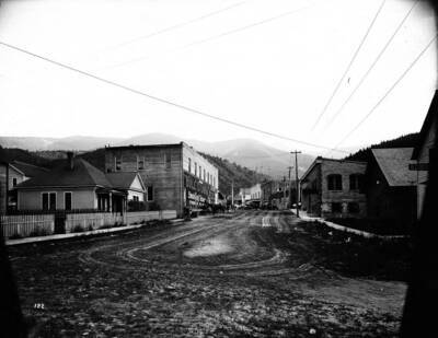 Image shows a Bull Durham tobacco advertisement on the side of a building on Main Street, Kellogg Idaho