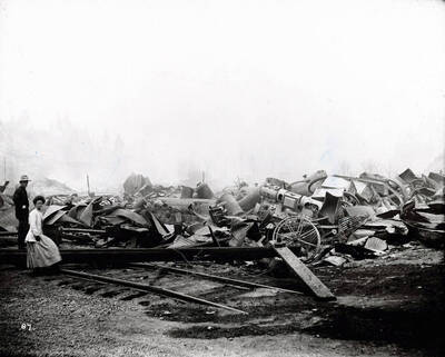 Image shows the debris from the Coeur d'Alene Hardware Warehouse on September 3, 1910 after the fire on August 20, 1910 swept went through Wallace, Idaho.