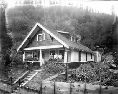 John Biloch and family pose for a picture on the porch of their house in Gem, Idaho.