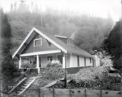 John Biloch and family pose for a picture on the porch of their house in Gem, Idaho.