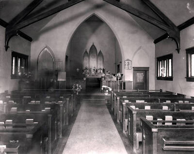 Interior view of the altar and pews in Holy Trinity Episcopal Church, Wallace, Idaho, 1925.