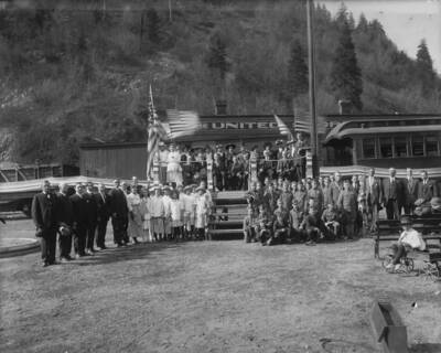 Showing group of people and flags.