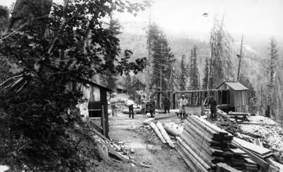 #4 Adit Tunnel, mine with men standing outside of it
