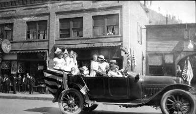 Parades- 4th of July, Children riding in car.