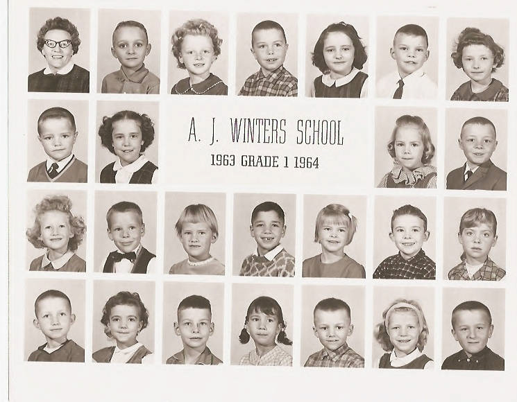 A grid of individual portraits featuring young children and one adult. The children are posed and dressed in various outfits typical of a school setting. In the center, text reads "A. J. Winters School 1963 Grade 1 1964."