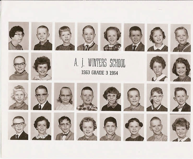 A grid of individual headshots, including a teacher and students, with the text "A. J. Winters School, 1963 Grade 3 1964" in the center. The top row features an adult and young boys, while the remaining rows show young boys and girls, all in formal attire.